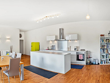 open-plan modern kitchen featuring a sleek island open-plan modern kitchen featuring a sleek island