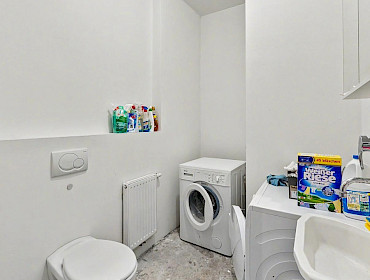 laundry room with washing machine, dryer, and toilet laundry room with washing machine, dryer, and toilet